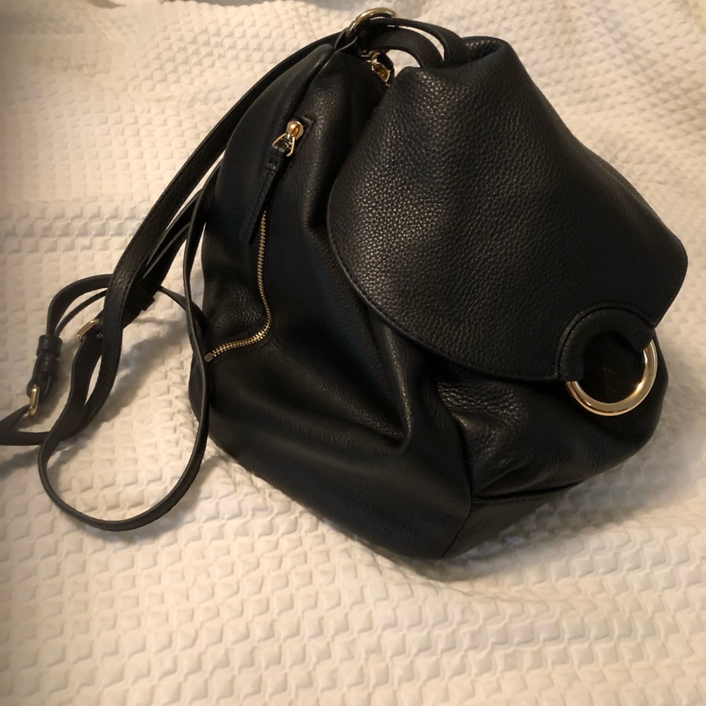 Vince Camuto unique black leather shoulder and optional backpack bag.